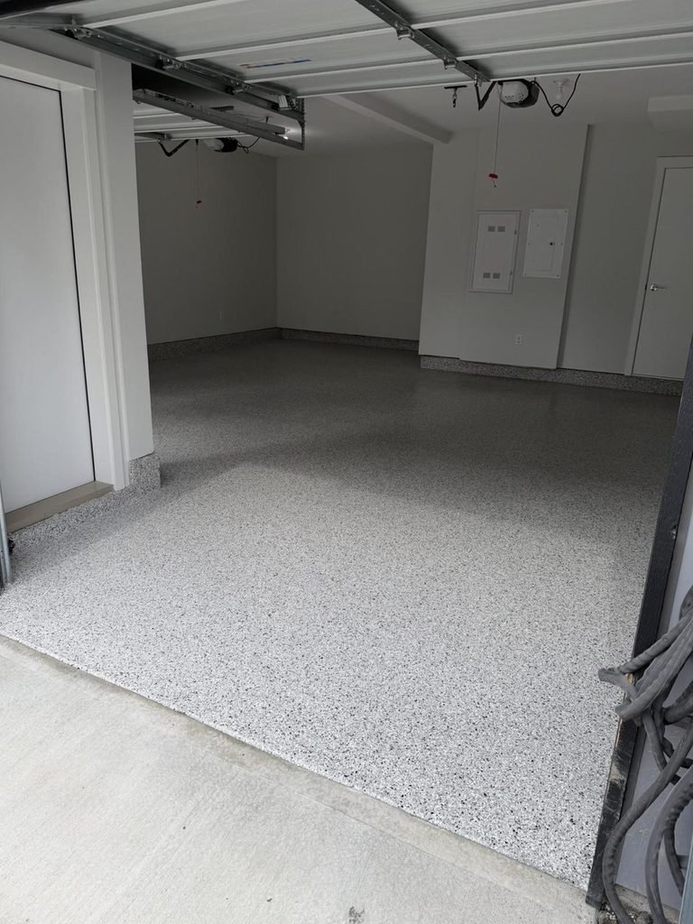 The same Surrey garage after a Coyote full-flake epoxy floor by Wish Coatings