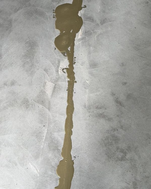 A garage control joint filled and repaired before coating