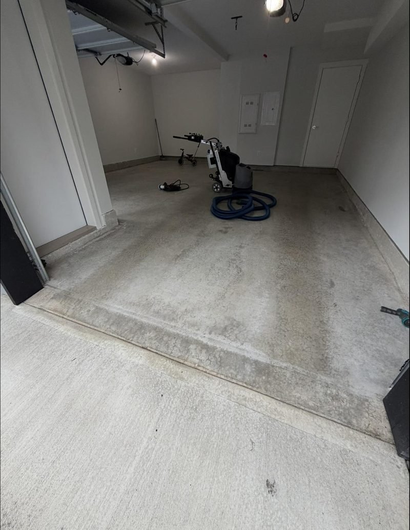 Surrey garage before: bare, stained concrete floor