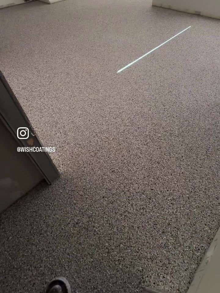 After: finished Coyote epoxy flake floor in a Tsawwassen veterinary clinic