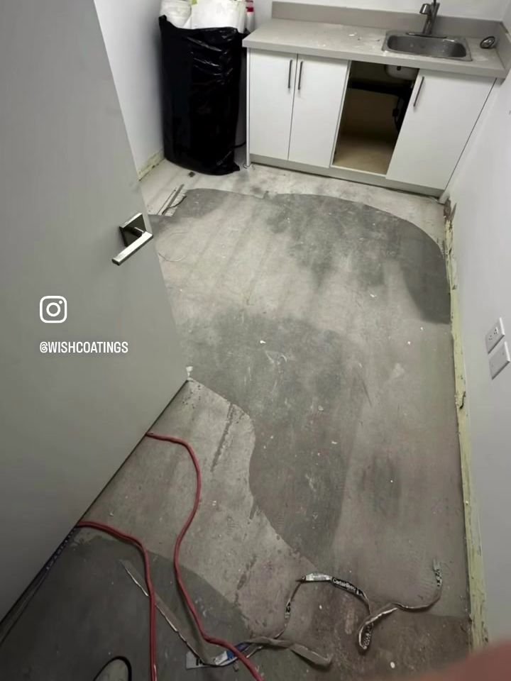 During prep: patched and levelled concrete in a treatment room of the Tsawwassen vet clinic