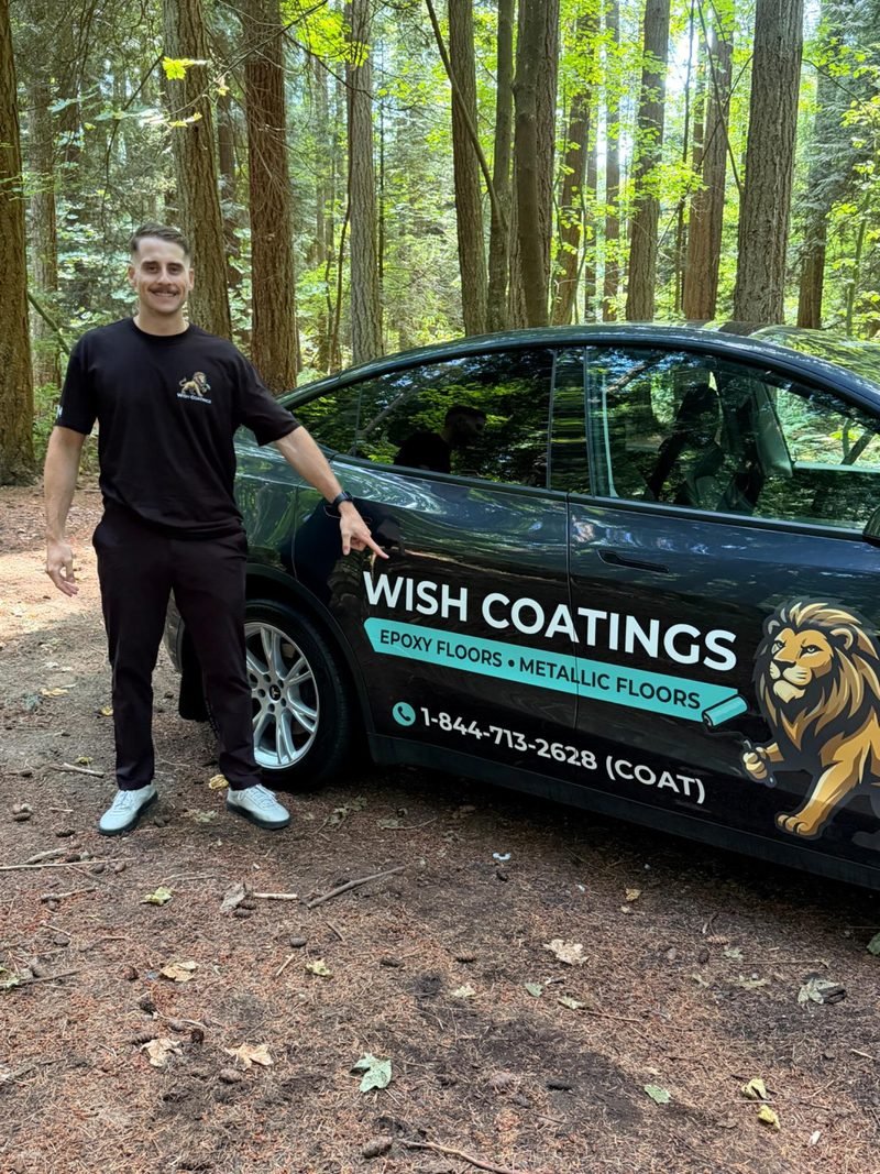 Wish Coatings co-owner standing beside the branded Wish Coatings car