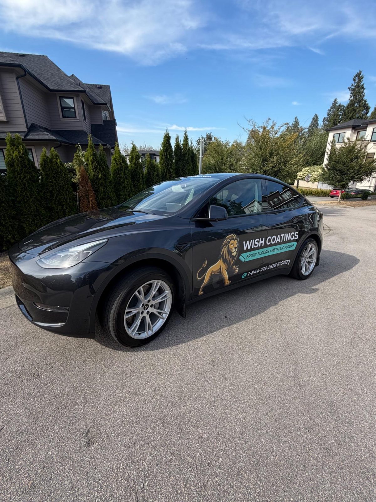 Wish Coatings branded Tesla parked on a Lower Mainland residential street